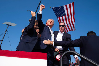 Trump, fist raised, bloody ear, USA flag, 2024 July 13